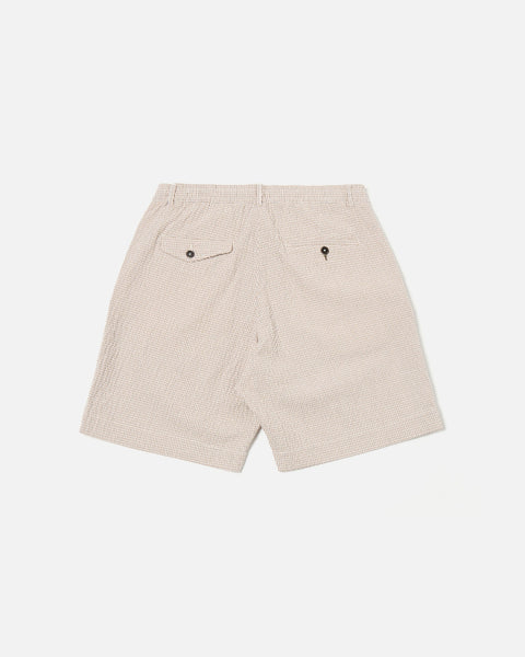 UNIVERSAL WORKS PLEATED TRACK SHORT IN ECRU/SAND OSPINA CHECK