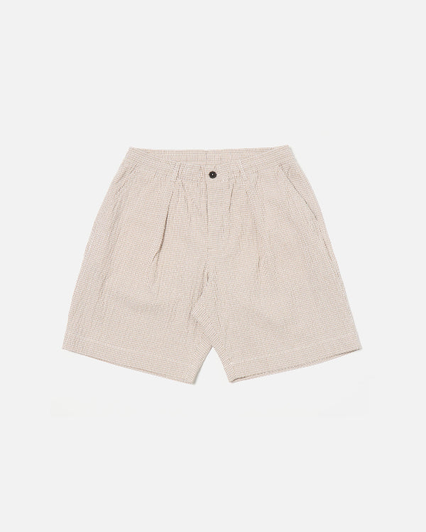 UNIVERSAL WORKS PLEATED TRACK SHORT IN ECRU/SAND OSPINA CHECK COTTON