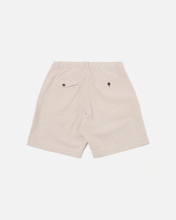 UNIVERSAL WORKS PLEATED TRACK SHORT IN ECRU/SAND OSPINA CHECK COTTON