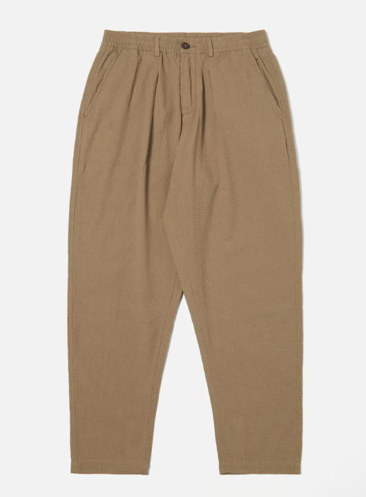 UNIVERSAL WORKS PLEATED TRACK PANT IN OLIVE COTTON SEERSUCKER 