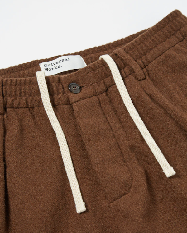 UNIVERSAL WORKS TRACK PANT IN CUMIN RECYCLED SOFT WOOL