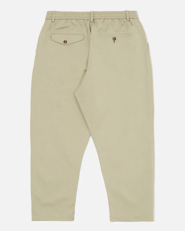 UNIVERSAL WORKS PLEATED TRACK PANT IN STONE TWILL