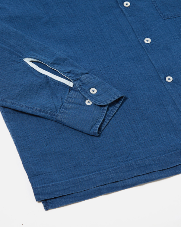 UNIVERSAL WORKS LONG SLEEVE CAMP SHIRT II IN WASHED INDIGO SEERSUCKER