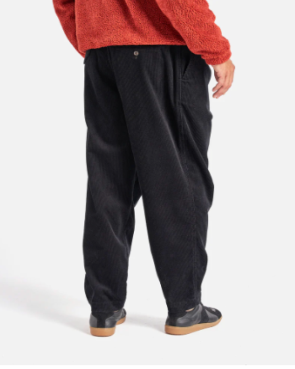 UNIVERSAL WORKS PLEATED TRACK PANT IN BLACK CORD