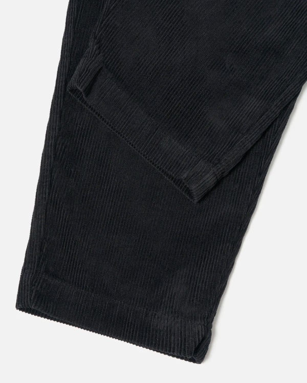 UNIVERSAL WORKS PLEATED TRACK PANT IN BLACK CORD