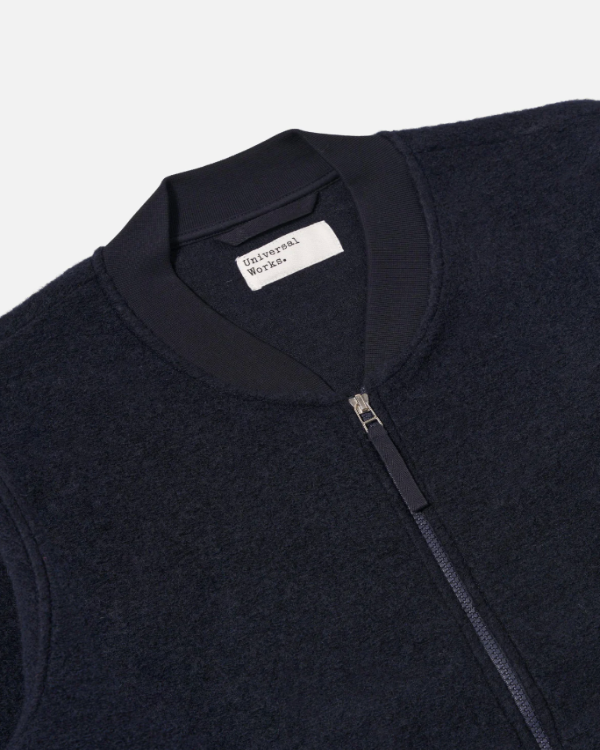UNIVERSAL WORKS ZIP BOMBER IN NAVY WOOL FLEECE