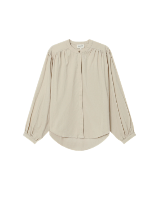 Beige blouse on a white background