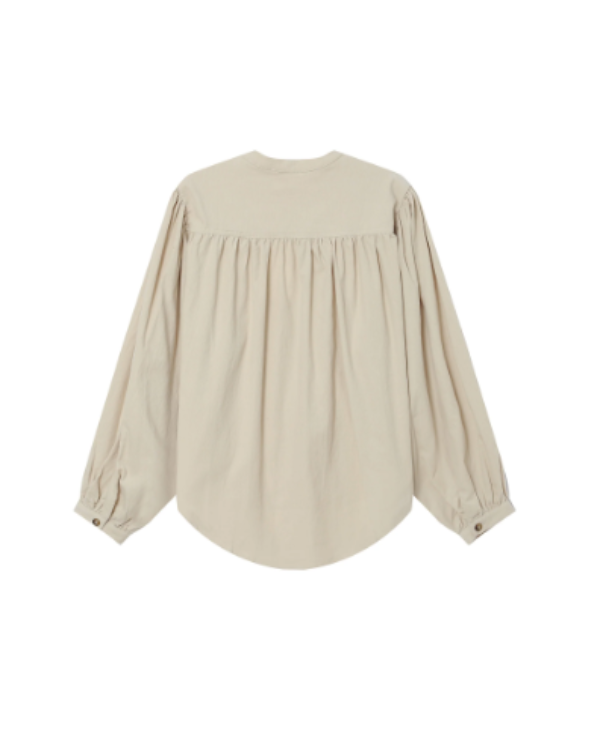 Beige blouse with long sleeves on a white background