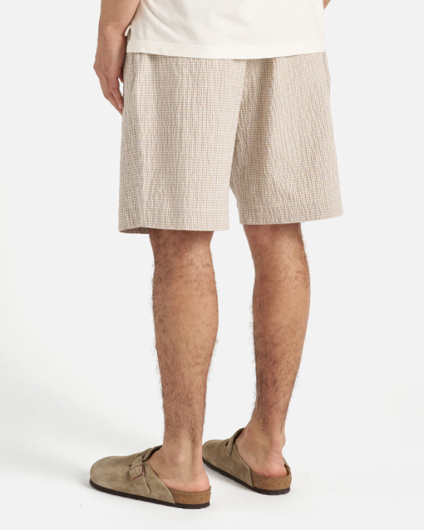 UNIVERSAL WORKS PLEATED TRACK SHORT IN ECRU/SAND OSPINA CHECK COTTON