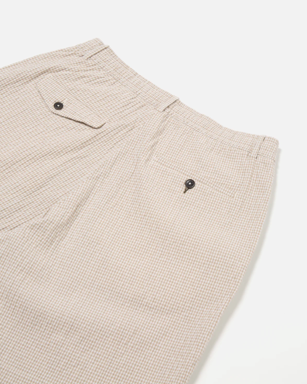 UNIVERSAL WORKS PLEATED TRACK SHORT IN ECRU/SAND OSPINA CHECK COTTON