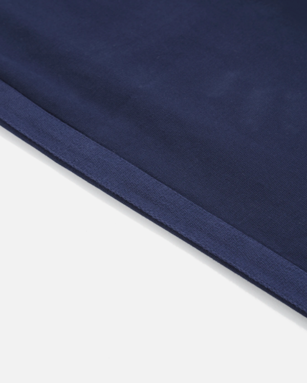 UNIVERSAL WORKS TRACK TROUSER IN NAVY CANVAS